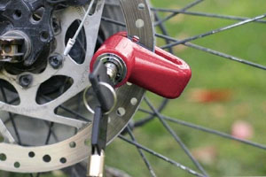 How do motorcycle disk locks work? 